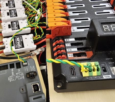 A pair of images. One showing a CAN bus connection to a roboRIO and one showing a connection to a PDH.